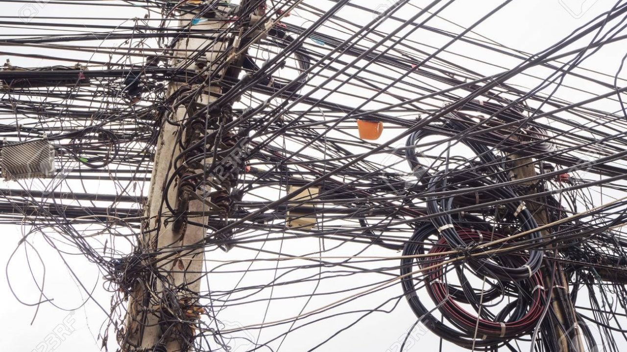 Chaos of cables and wires on electric pole in Chiang Mai,Thailand.