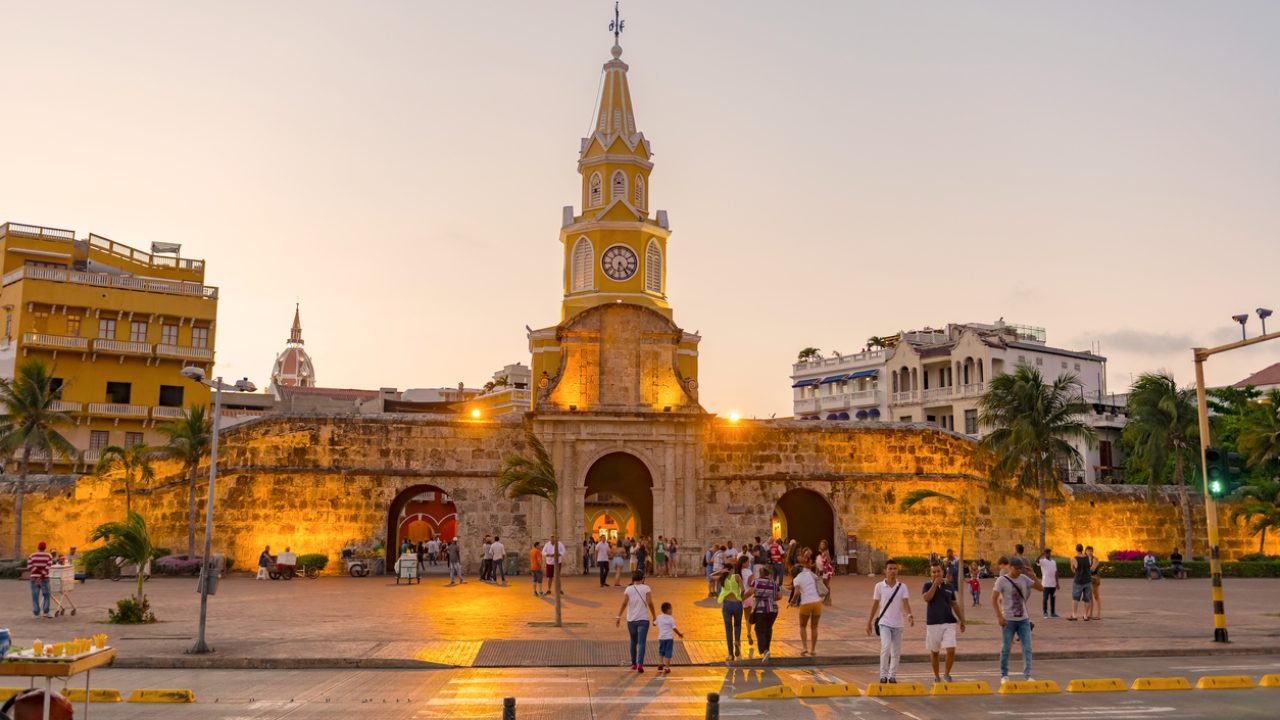 Cartagena: People entering Cartagena's most famous landmark, The Torre del Reloj, or Clock Tower. It was once the main gateway to the walled city. Construction on the tower begun in 1601, and in 1631 the tower became the principal door to the city as the fortifications around the city were completed.